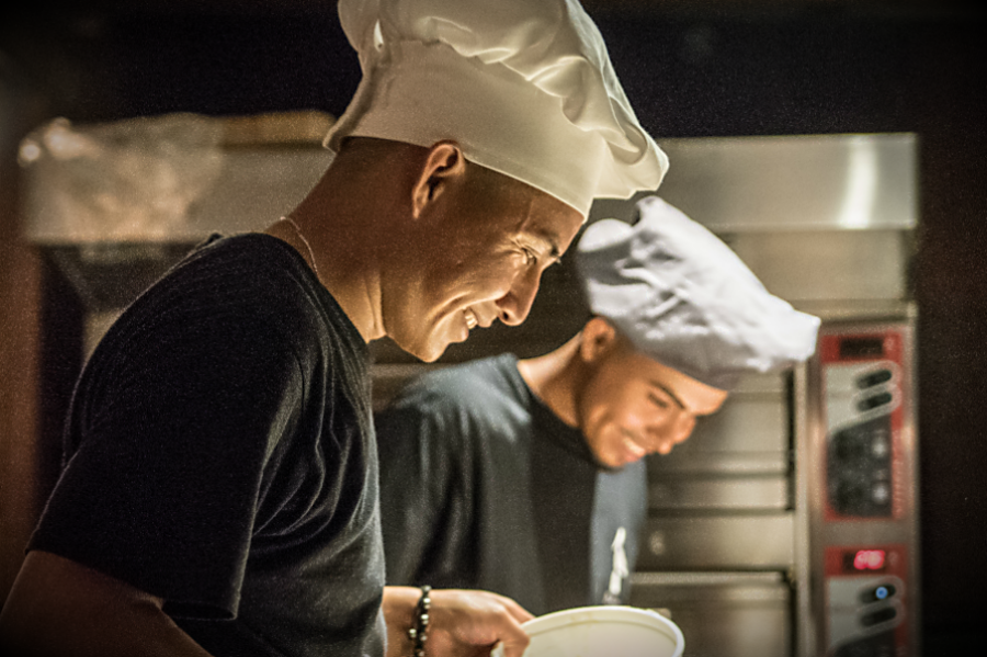 Young chefs smiling at Il Pellicano restaurant 