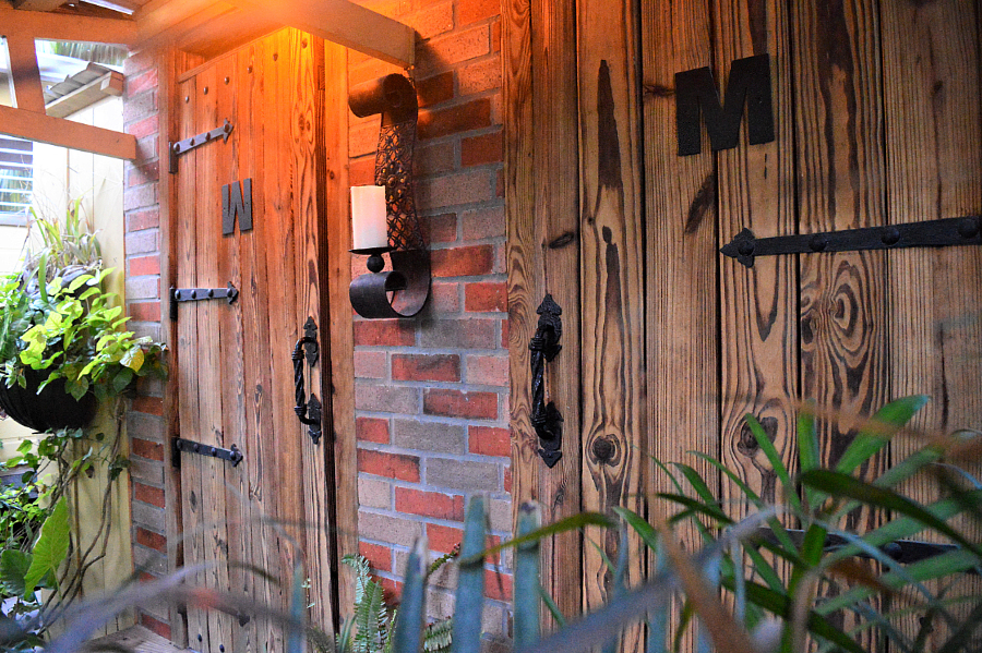 Heavy wooden doors of the restrooms in a classy restaurant